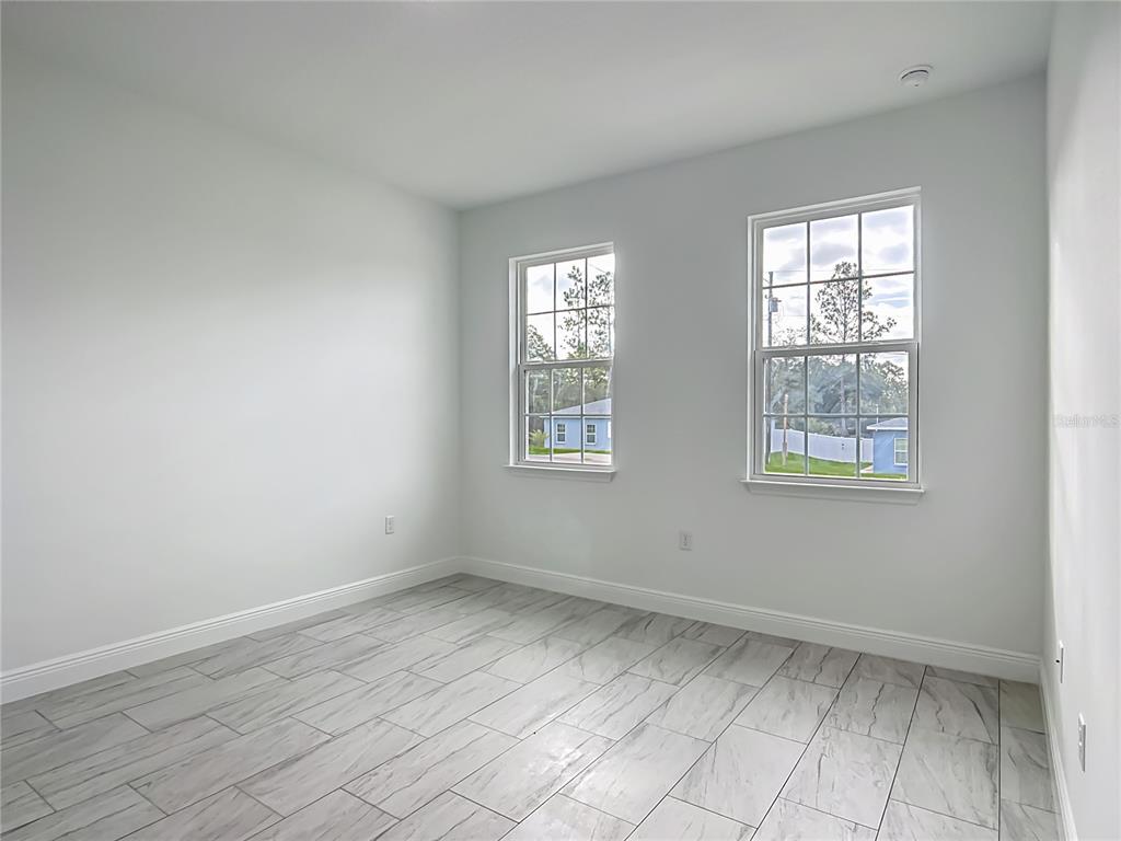5736 North Claremont Drive Citrus Springs, FL 34434 - Photo 24 of 45 an empty room with windows