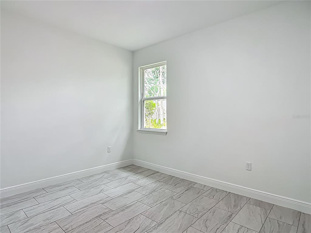 5736 North Claremont Drive Citrus Springs, FL 34434 - Photo 30 of 45 an empty room with a window