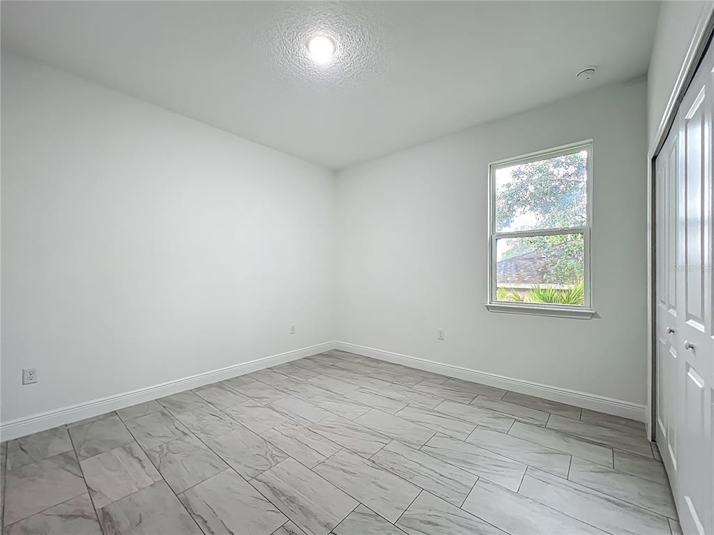5736 North Claremont Drive Citrus Springs, FL 34434 - Photo 34 of 45 an empty room with a window