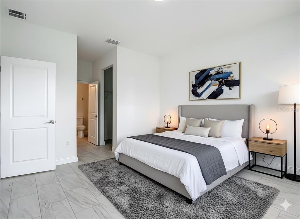 5736 North Claremont Drive Citrus Springs, FL 34434 - Photo 6 of 45 a bedroom with a bed and a painting on the wall