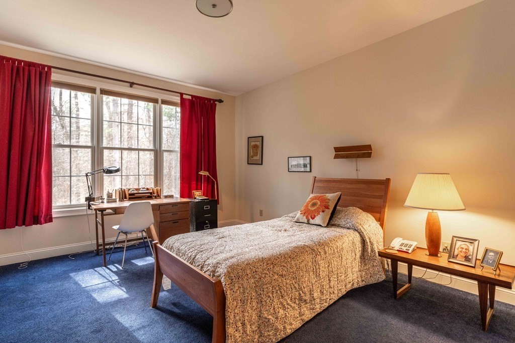 359 Main Street, Unit 15A Easthampton, MA 01027 - Photo 12 of 24 a bed room with a bed and a chair