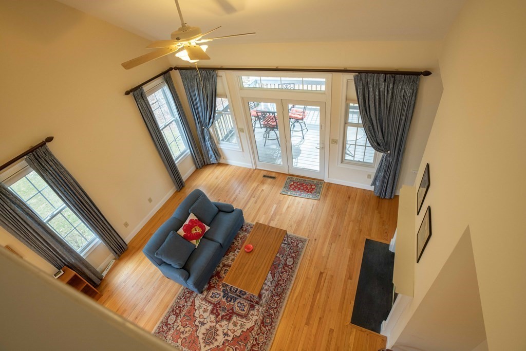 359 Main Street, Unit 15A Easthampton, MA 01027 - Photo 16 of 24 a view of wooden floor in a hall with a window