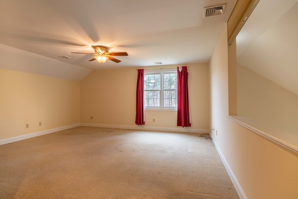 359 Main Street, Unit 15A Easthampton, MA 01027 - Photo 18 of 24 an empty room with windows and fan