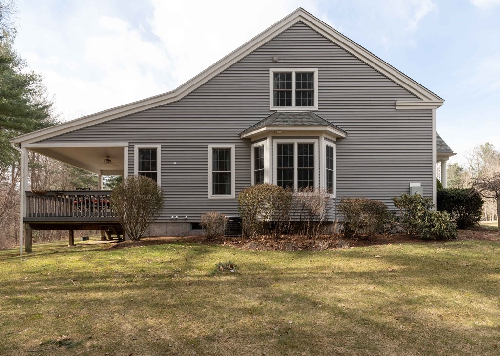 359 Main Street, Unit 15A Easthampton, MA 01027 - Photo 21 of 24 a front view of a house with a yard