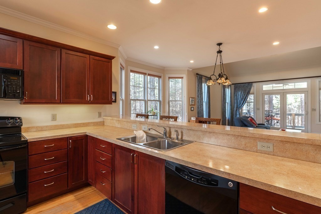 359 Main Street, Unit 15A Easthampton, MA 01027 - Photo 4 of 24 a kitchen with a sink and large window