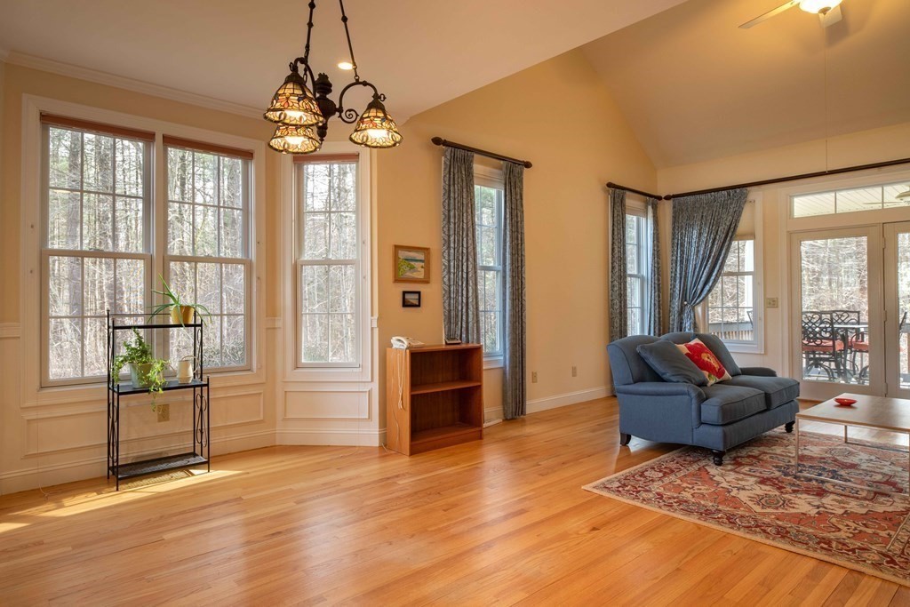 359 Main Street, Unit 15A Easthampton, MA 01027 - Photo 6 of 24 a living room with furniture and a floor to ceiling window