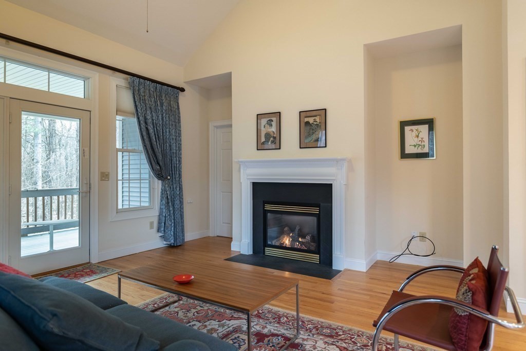 359 Main Street, Unit 15A Easthampton, MA 01027 - Photo 7 of 24 a living room with furniture and a fireplace