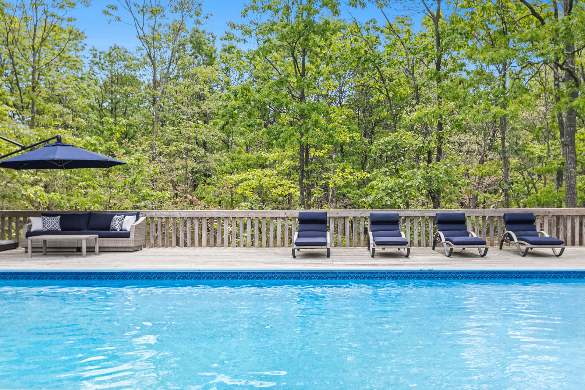 219 Town Line Road Wainscott, NY 11975 - Photo 17 of 19 a view of a ocean with a lounge chair