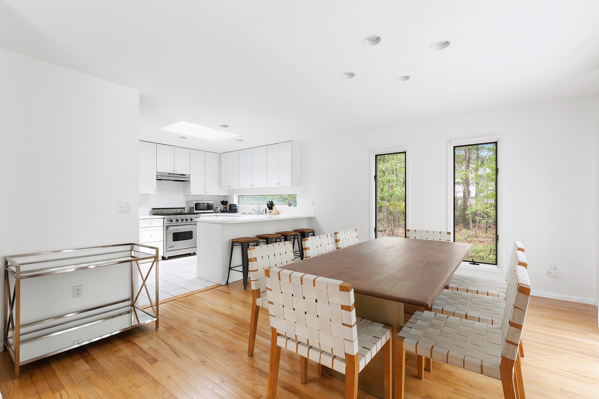 219 Town Line Road Wainscott, NY 11975 - Photo 3 of 19 a living room with furniture and kitchen view