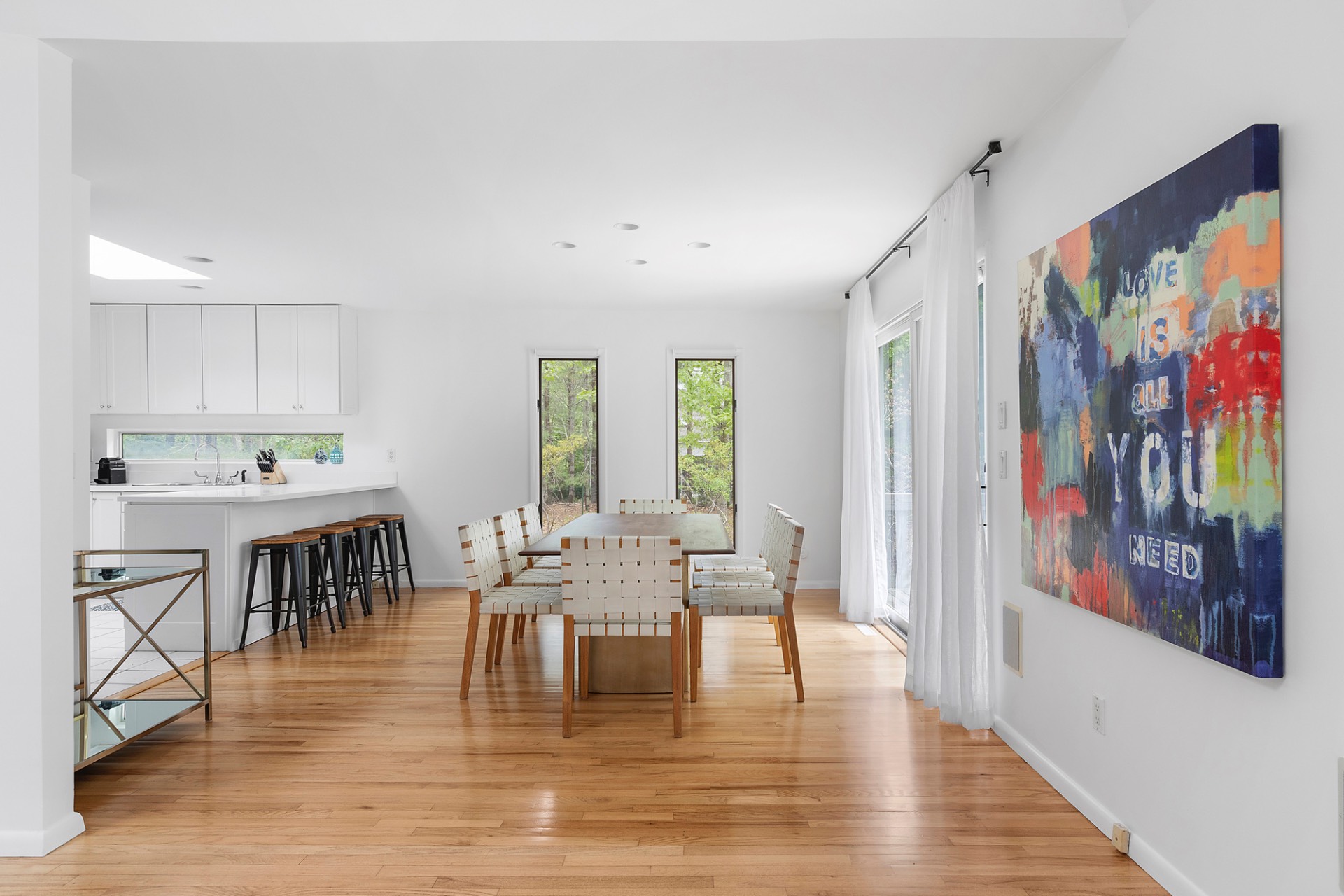 219 Town Line Road Wainscott, NY 11975 - Photo 4 of 19 a living room with fireplace furniture and a wooden floor