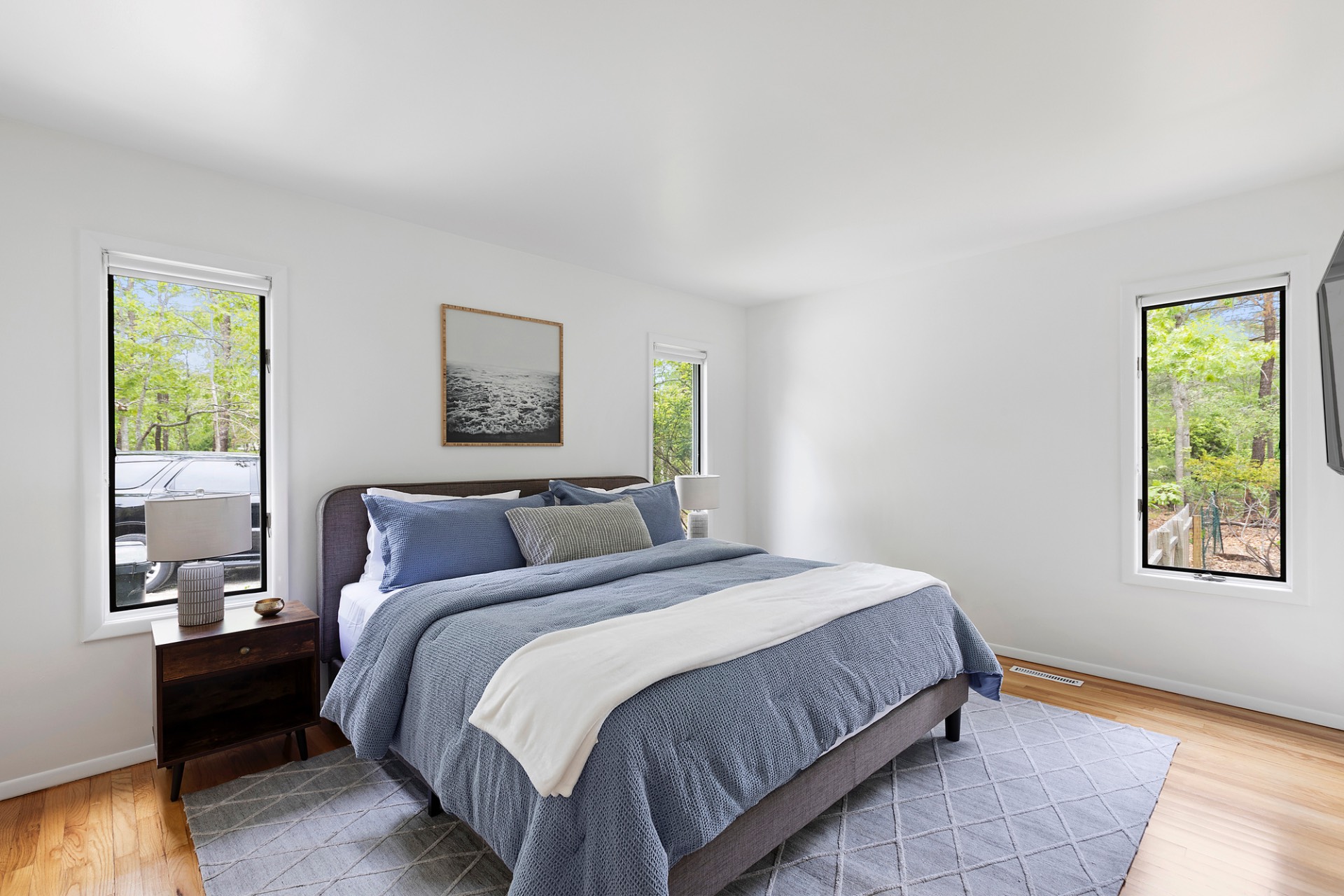 219 Town Line Road Wainscott, NY 11975 - Photo 9 of 19 a bedroom with a bed and a window