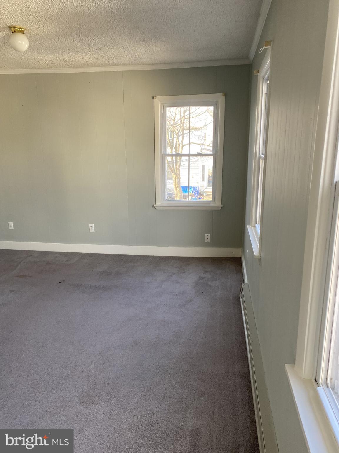 321 Choptank Avenue Cambridge, MD 21613 - Photo 11 of 15 an empty room with windows