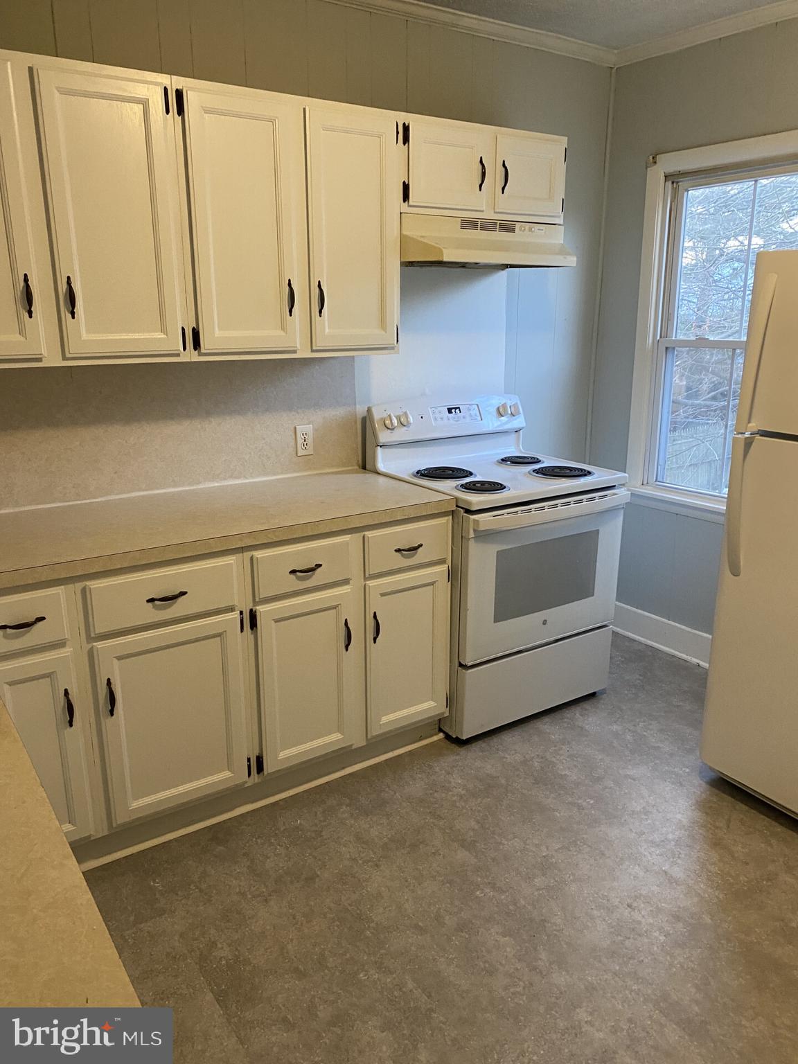 321 Choptank Avenue Cambridge, MD 21613 - Photo 10 of 15 a kitchen with cabinets appliances and a sink
