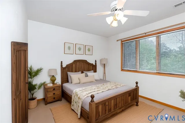 a view of a patio with table and chairs