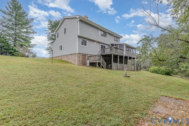a view of a patio with table and chairs