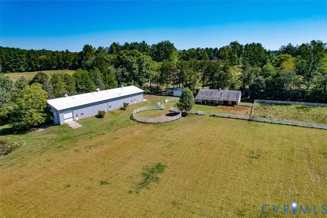 a living room with furniture a window and a fireplace
