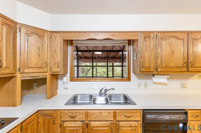 a bathroom with a sink a bathtub and a window