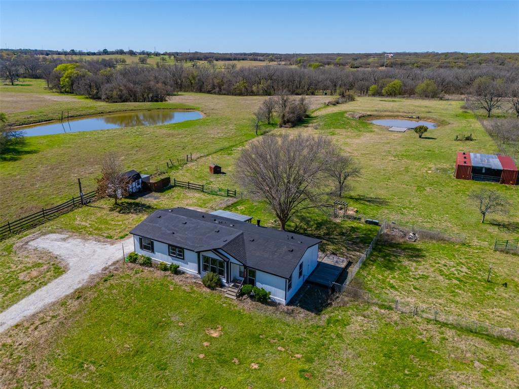 181 Pr 125 Whitney, TX 76692 - Photo 5 of 34 Aerial view of 13 acre property with home and pond in Whitney Texas