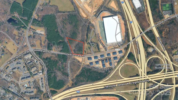 a utility room with a sink a mirror and next to a window