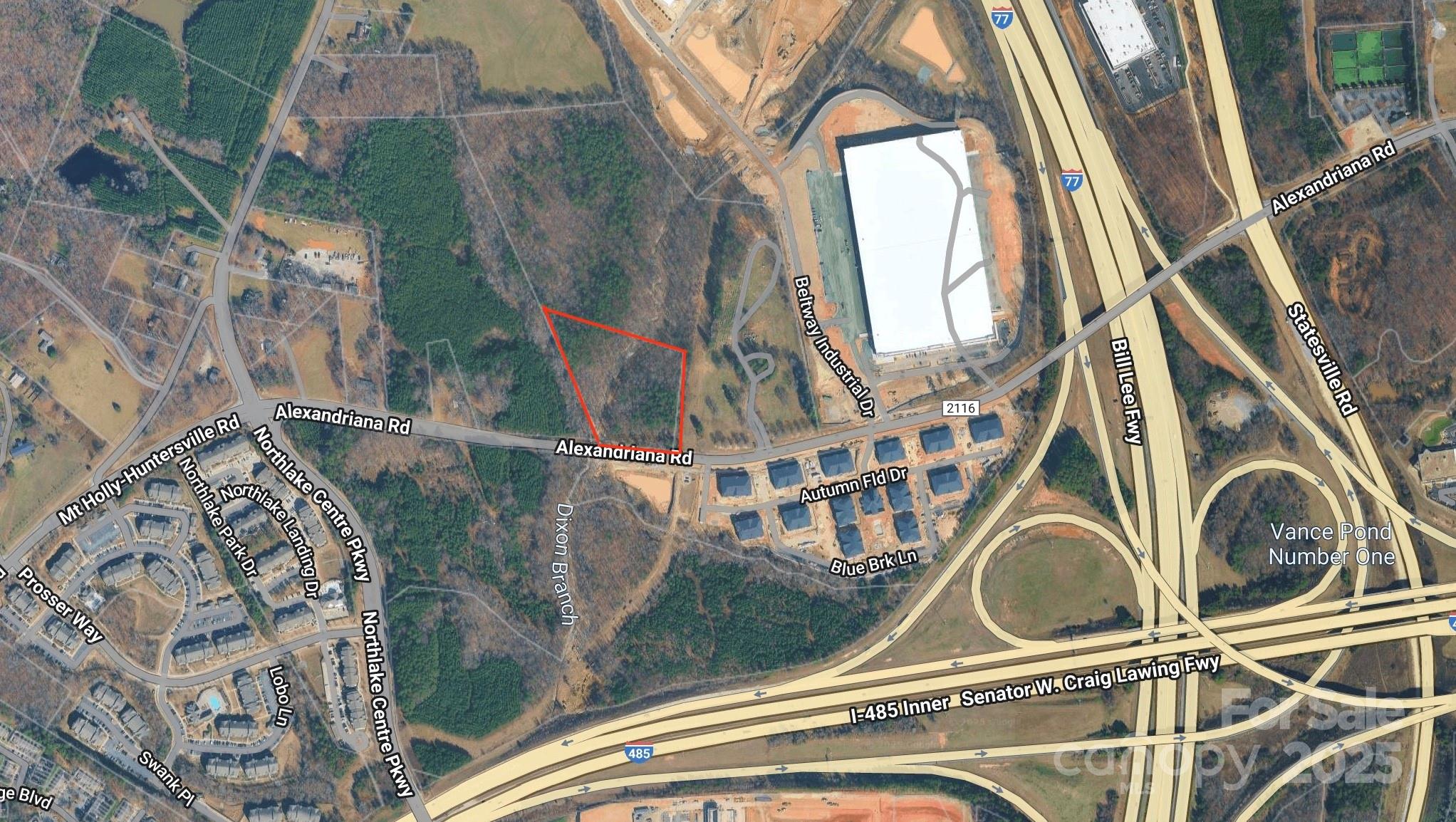 11012 Alexandriana Road Huntersville, NC 28078 - Photo 2 of 2 a utility room with a sink a mirror and next to a window