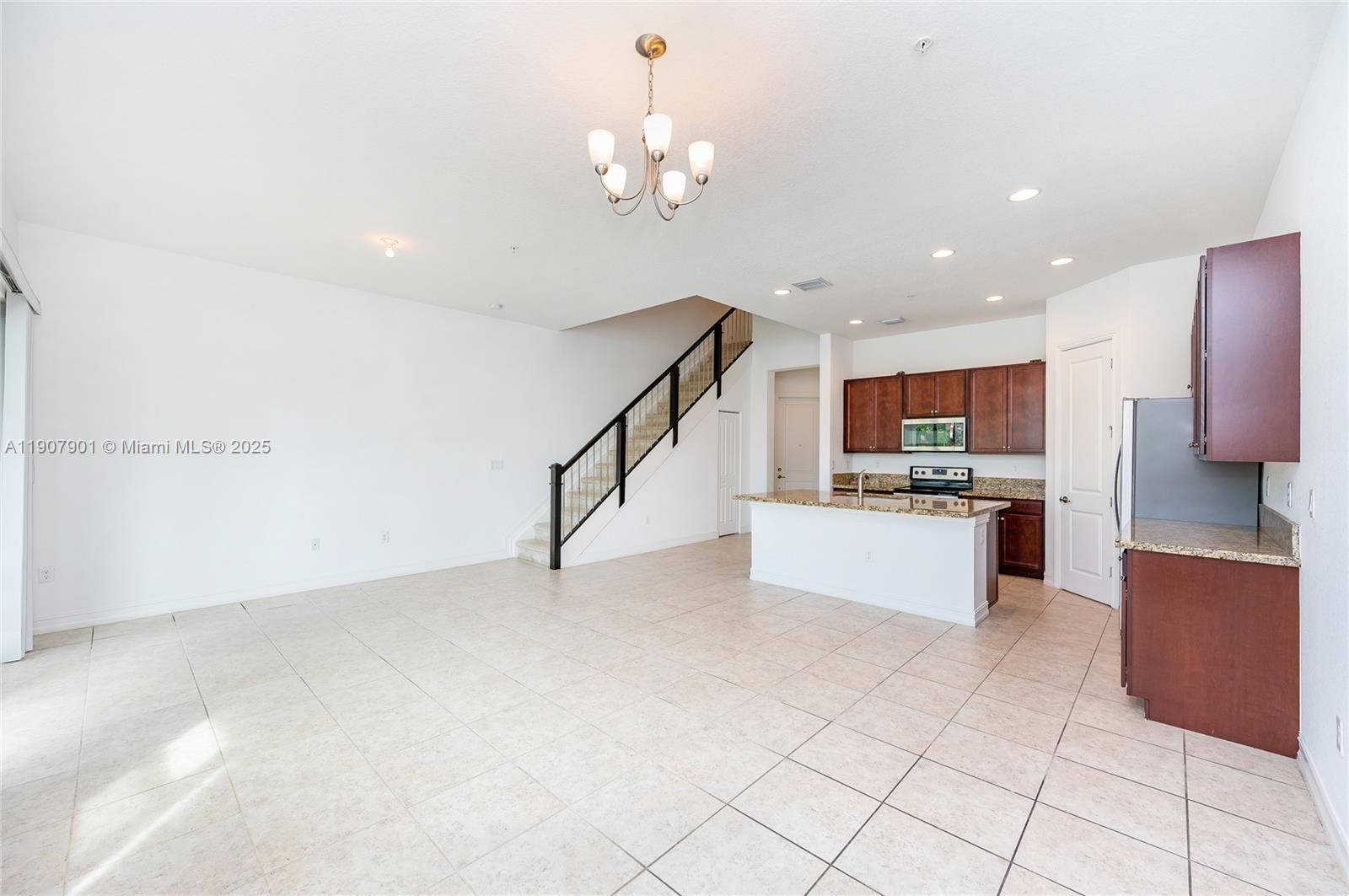 11670 Southwest 13th Lane, Unit 11670 Pembroke Pines, FL 33025 - Photo 21 of 38 a view of kitchen with stainless steel appliances cabinets and window