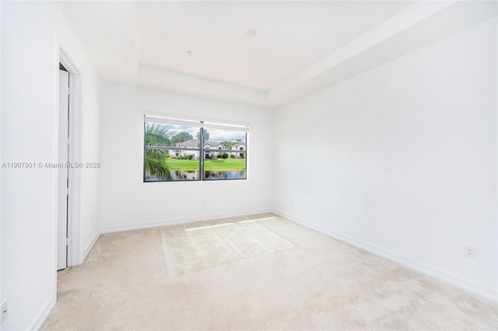 11670 Southwest 13th Lane, Unit 11670 Pembroke Pines, FL 33025 - Photo 23 of 38 a view of an empty room with a window