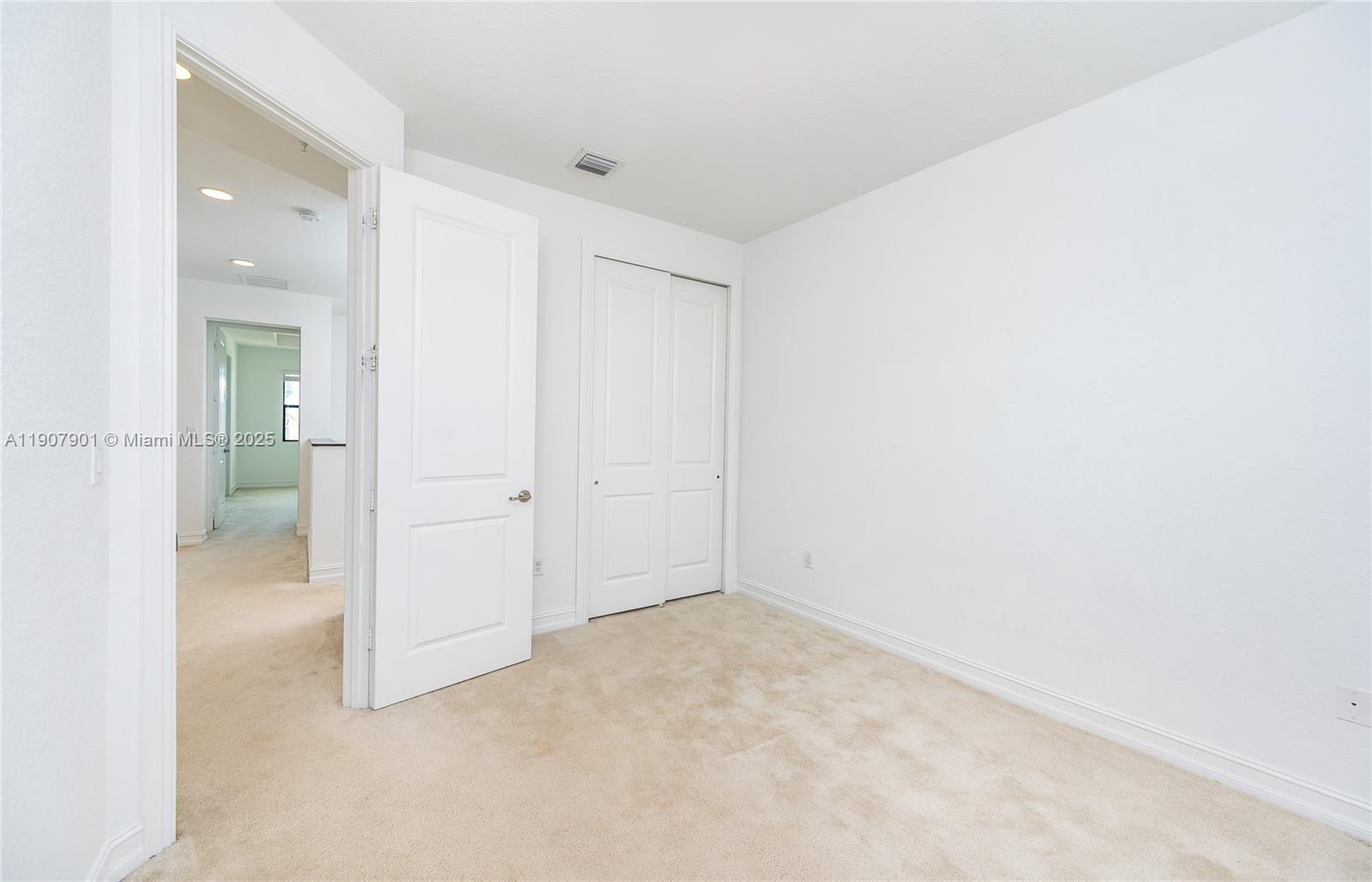 11670 Southwest 13th Lane, Unit 11670 Pembroke Pines, FL 33025 - Photo 29 of 38 an empty room with an entrance to other room
