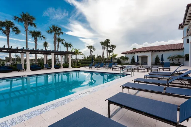 a view of a swimming pool with lounge chairs