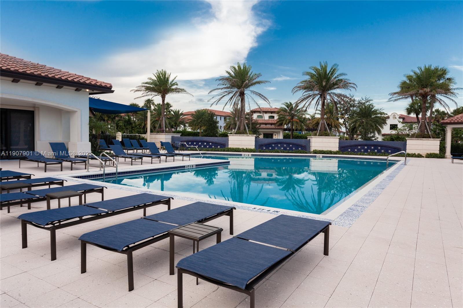 11670 Southwest 13th Lane, Unit 11670 Pembroke Pines, FL 33025 - Photo 37 of 38 a view of a swimming pool with lounge chairs