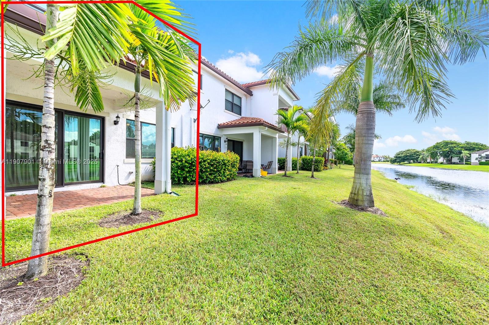 11670 Southwest 13th Lane, Unit 11670 Pembroke Pines, FL 33025 - Photo 5 of 38 a house with garden in front of it