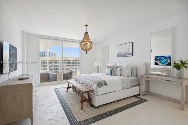 a bedroom with a bed and a large window