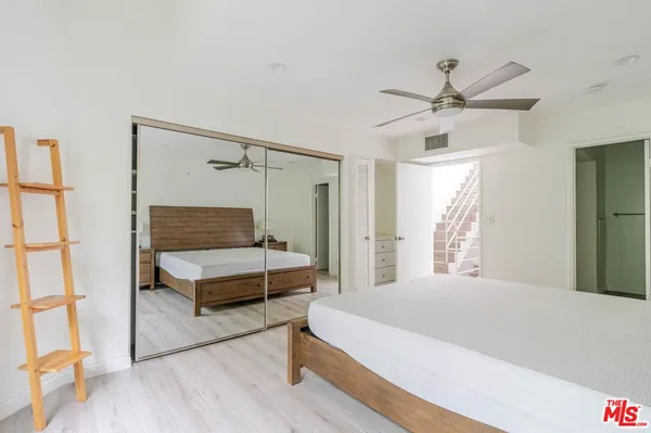 a bathroom with a shower and a sink