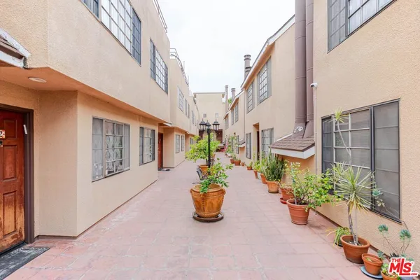 a view of a building with potted plants