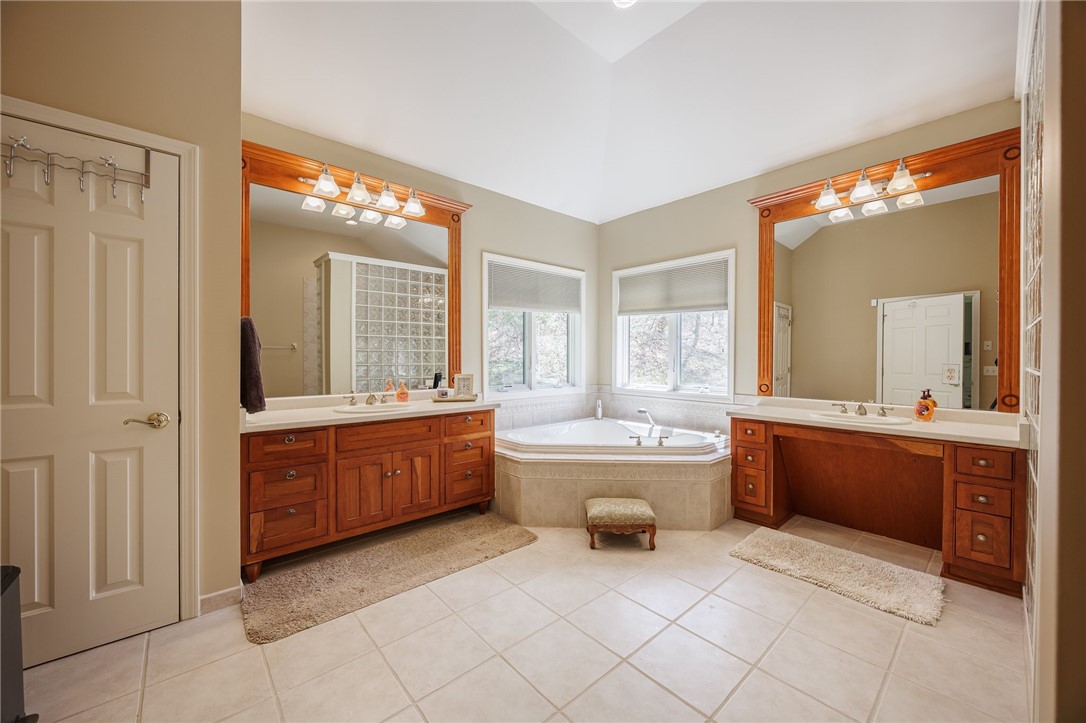 7638 Pine Tree Drive Victor, NY 14564 - Photo 28 of 50 The primary bathroom features double sinks and a s