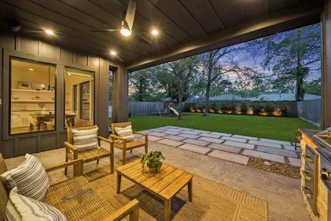 a outdoor space with patio lots of furniture and garden view