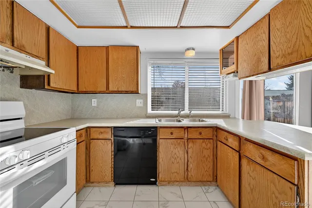 a kitchen with a sink and a window