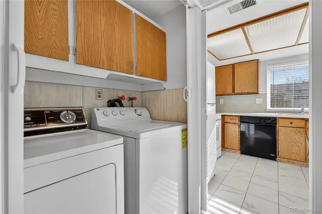 a kitchen with a stove top oven and refrigerator