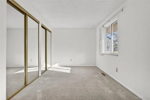 a view of an empty room with window