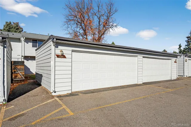 an aerial view of a residential apartment building with swimming pool