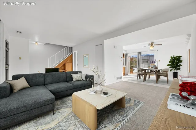 a living room with furniture and a table