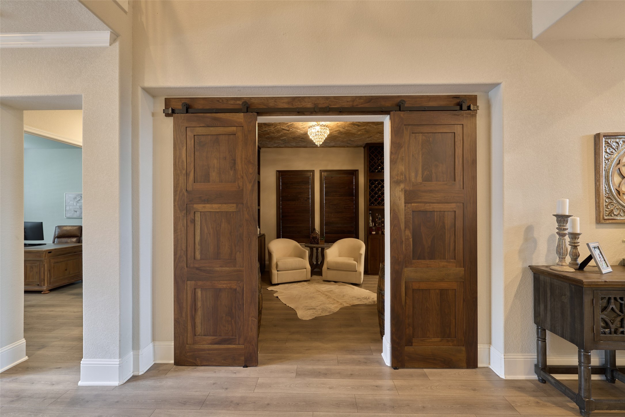 10090 South Goshawk Trail Conroe, TX 77385 - Photo 12 of 43 Just past the study is the Formal Dining Room currently being used as a "Tasting Room". Decorative sliding doors flank the opening.