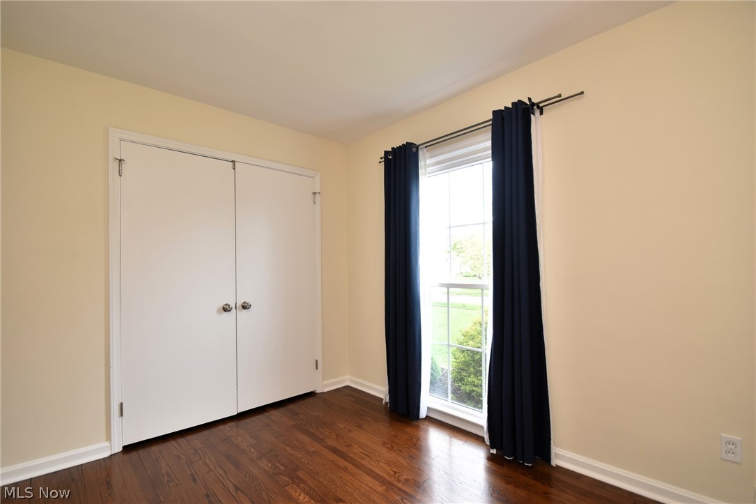23901 Hazelmere Road Shaker Heights, OH 44122 - Photo 27 of 35 Unfurnished bedroom with a closet and dark hardwood / wood-style floors