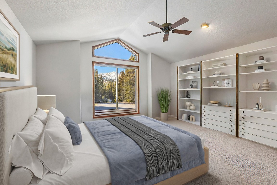 617 Moonstone Road Breckenridge, CO 80424 - Photo 14 of 21 a bedroom with a large bed and a window