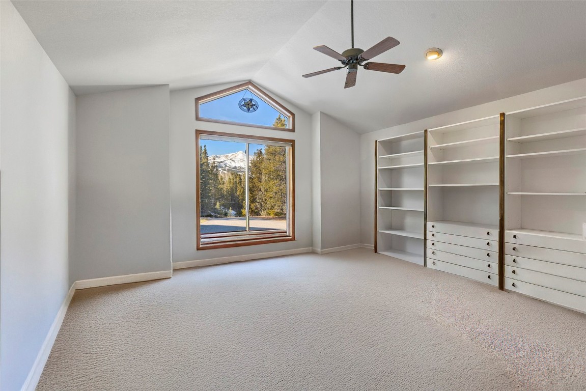 617 Moonstone Road Breckenridge, CO 80424 - Photo 15 of 21 wooden floor in an empty room with a ceiling fan