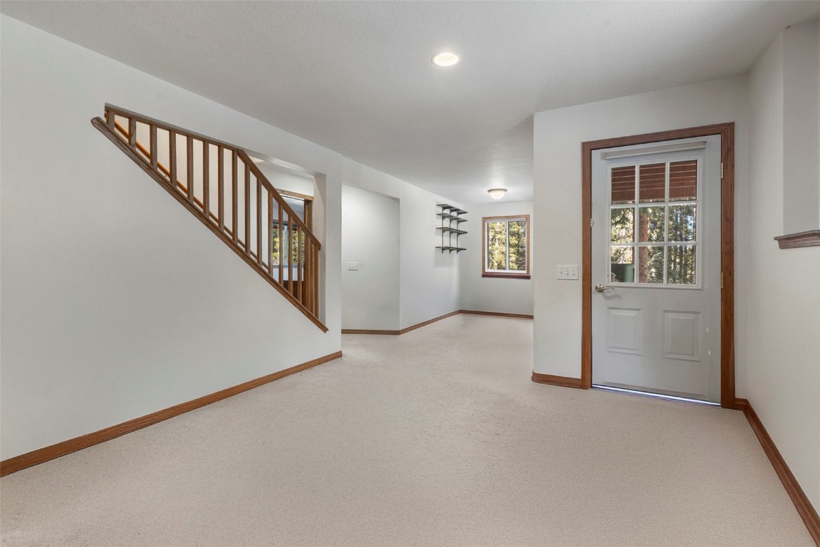 617 Moonstone Road Breckenridge, CO 80424 - Photo 19 of 21 an entryway and hallway with stairs