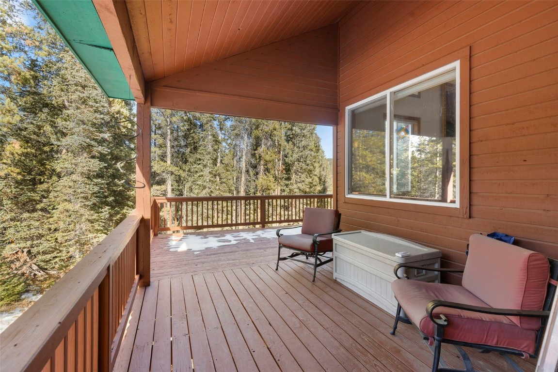 617 Moonstone Road Breckenridge, CO 80424 - Photo 6 of 21 a balcony with wooden floor and outdoor seating