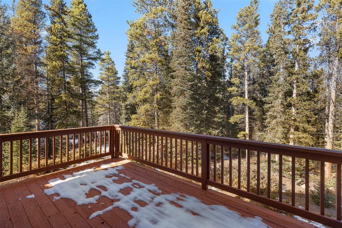 617 Moonstone Road Breckenridge, CO 80424 - Photo 8 of 21 a balcony with wooden floor and fence