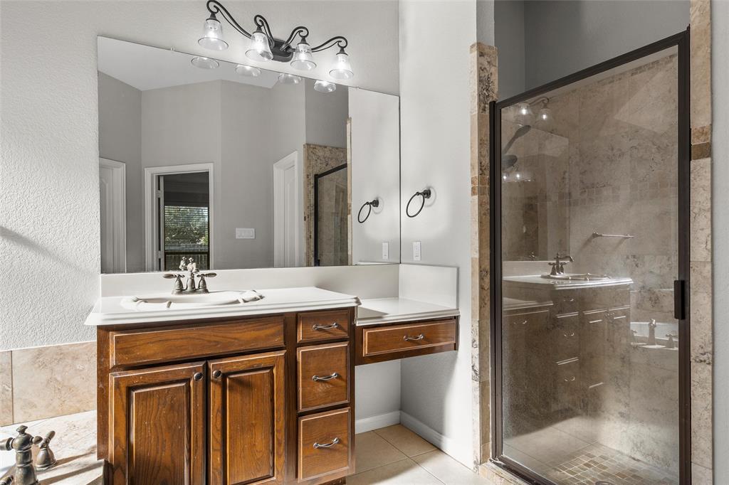 302 Canterbury Road Waco, TX 76712 - Photo 16 of 29 a bathroom with a sink mirror and a shower
