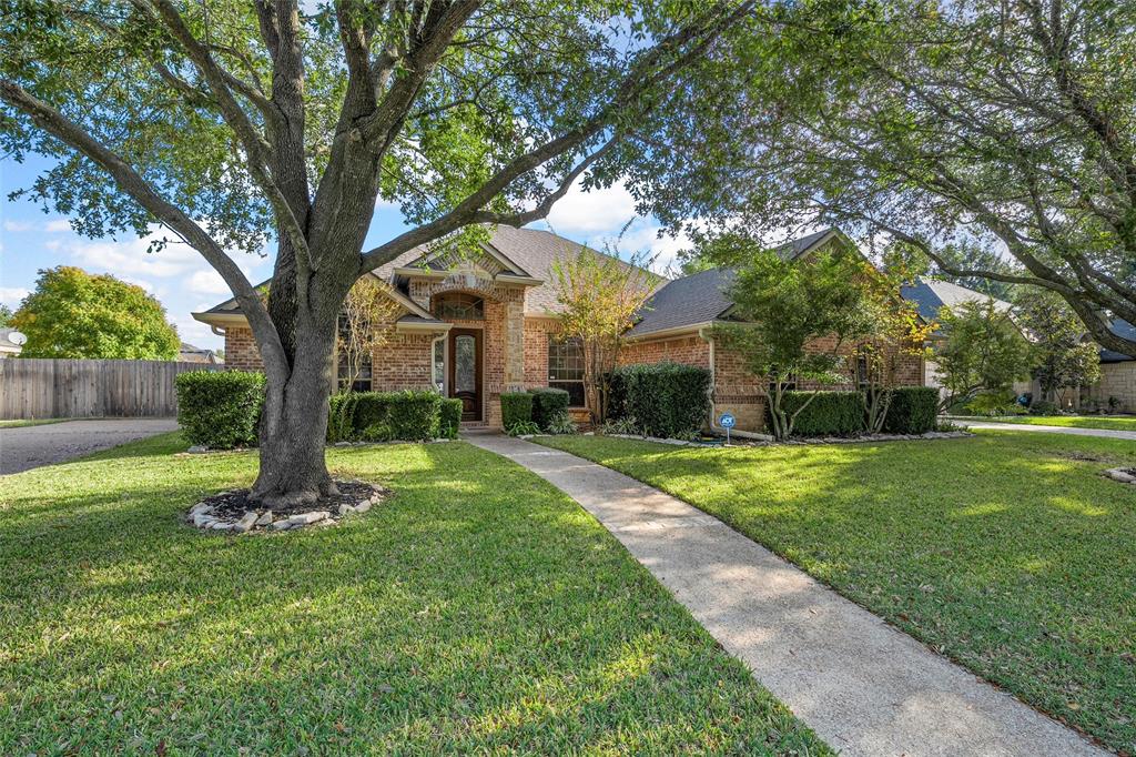 302 Canterbury Road Waco, TX 76712 - Photo 2 of 29 a front view of a house with a yard