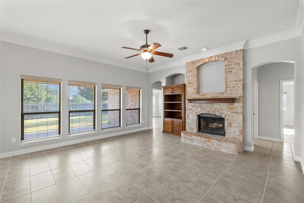 302 Canterbury Road Waco, TX 76712 - Photo 7 of 29 a view of an empty room with chandelier fan and fire place